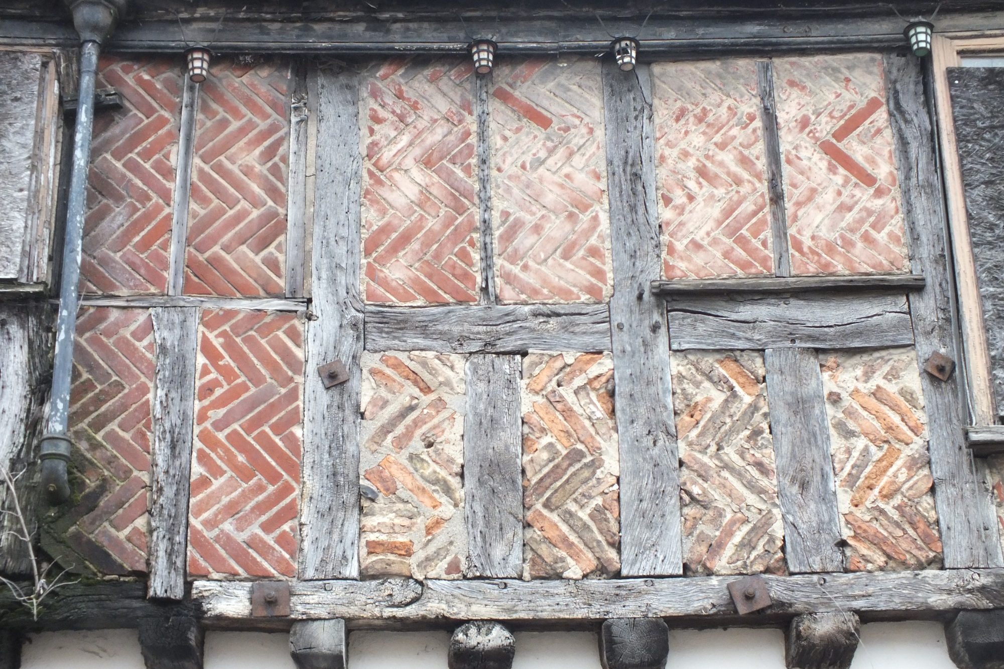 A part of 125 King Street Norwich showing a mix of modern and historic herringbone brickwork infill, Norwich Norfolk