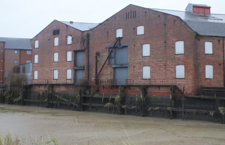 Rear river side elevation of warehouses and cargo jib at Whitehouse lane upon River Witham, Boston, Lincolnshire 